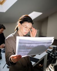 Professional woman analyzing financial charts