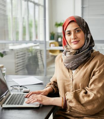 Woman smiling while working with documents
